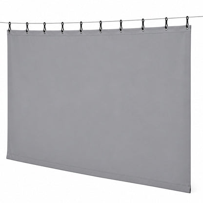 Heavy duty protective curtain with black straps and snaps hanging from a steel cable