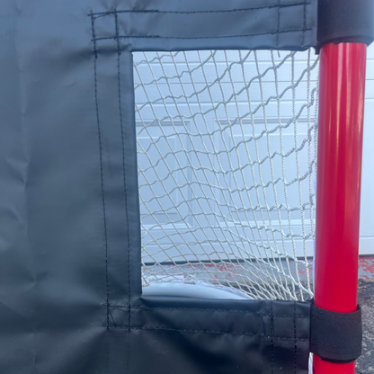 Heavy-duty attachment system securing the Pro Habits Hockey Shooting Tarp to a hockey net
