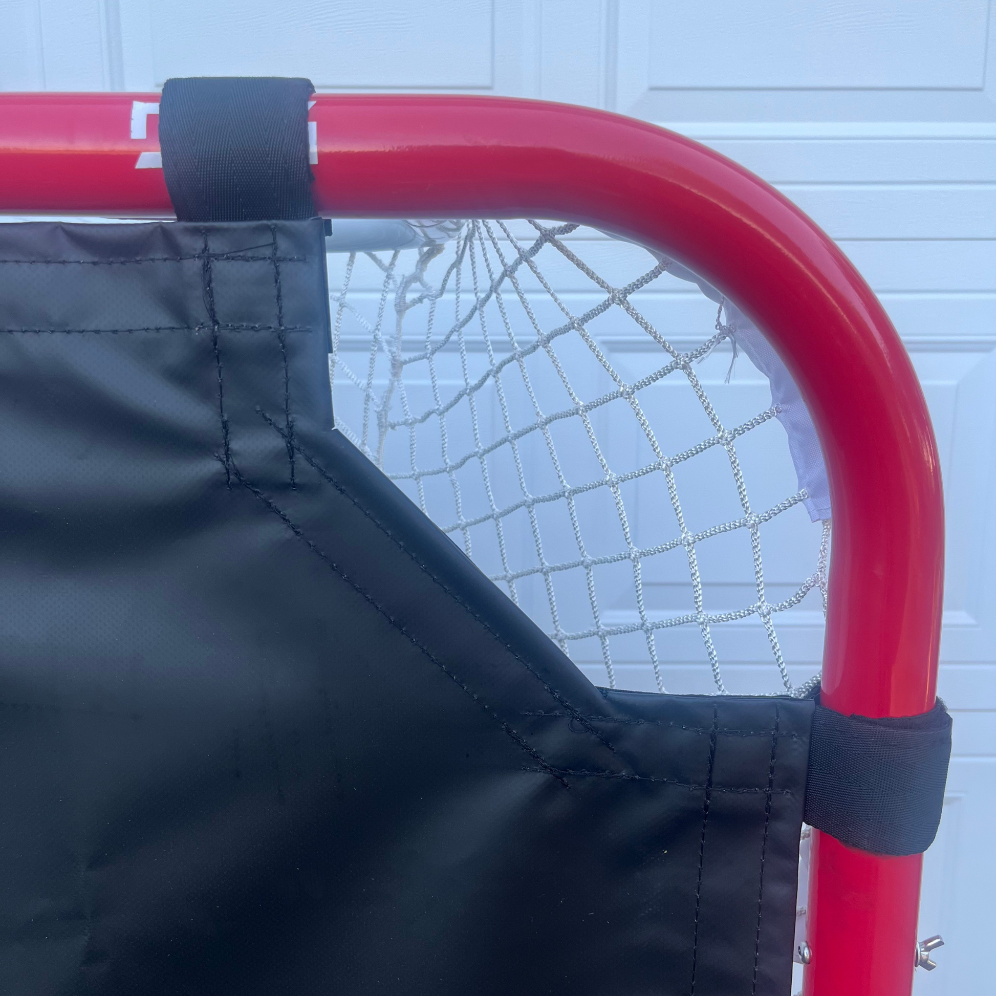 Reinforced corner of the Pro Habits Hockey Shooting Tarp for long-lasting durability