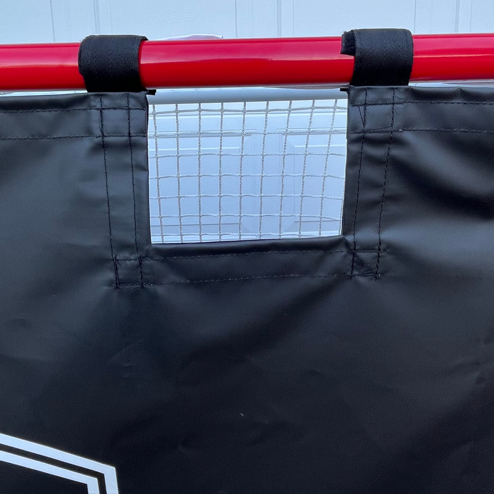 Heavy-duty Velcro straps for fast installation of the Pro Habits Hockey Shooting Tarp
